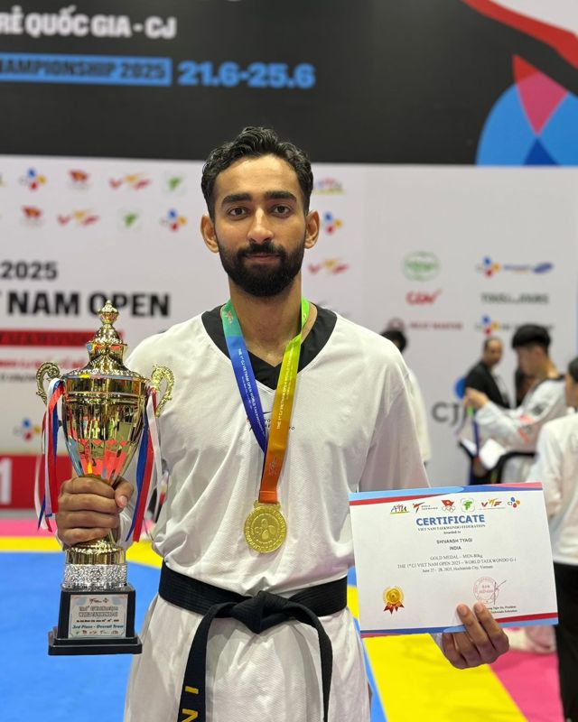 Shivansh Tyagi with a trophy, medal and certificate